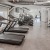 Large fitness center with cardio and weight lifting equipment.