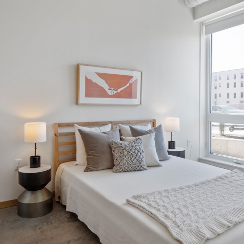 bedroom Spacious and well lit bedroom with plush carpet and large windows